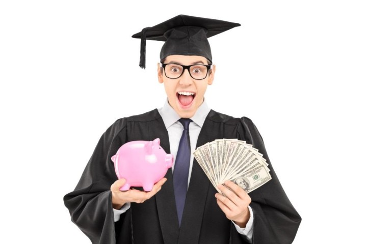 Male student holding money and a piggybank isolated on white background